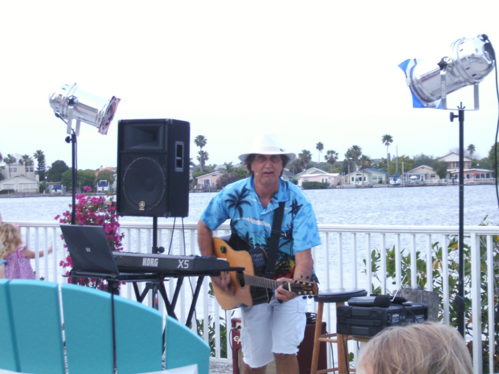 Bobby Smith on Guitar by the lake